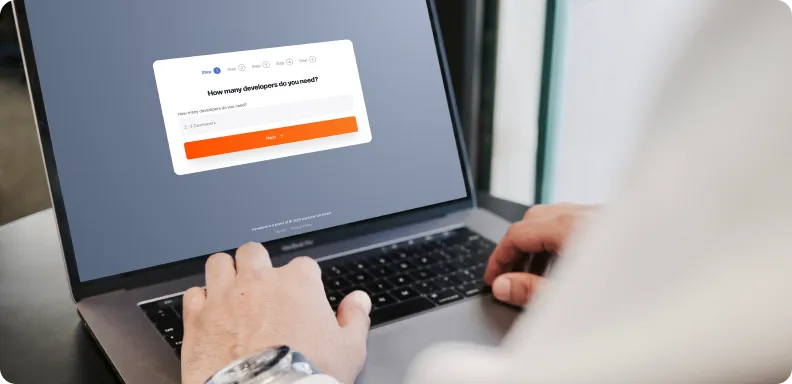 A person is seen interacting with a web survey on a laptop screen, which asks, 'How many developers do you need?' with options ranging from 1 to 5 developers and a 'Next' button.