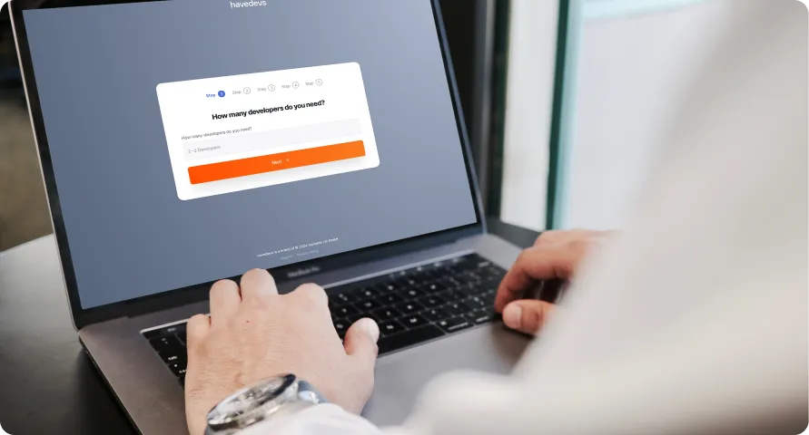 A person filling out a form on a laptop